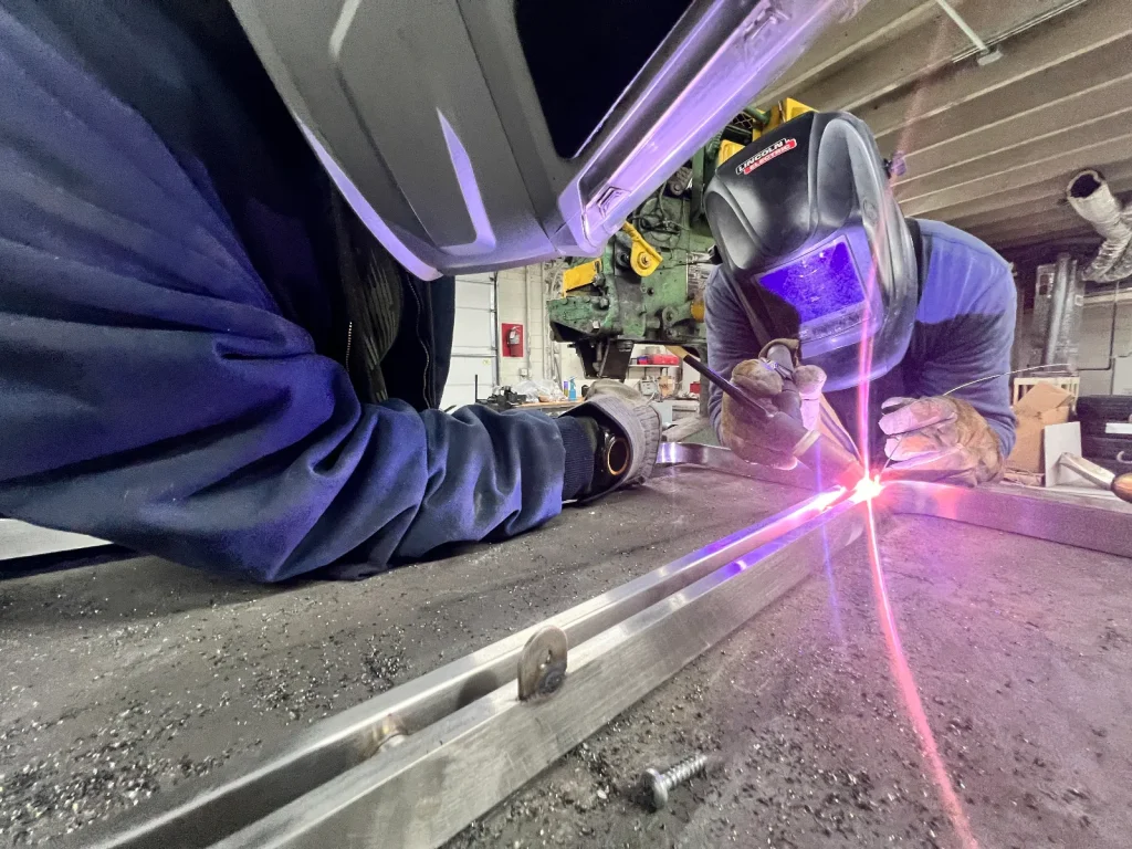 Welder working on a metal weld